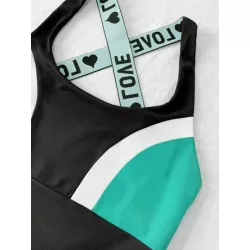 Mono deportivo de color combinado con cinta con letra con tira cruzada de espalda abierta