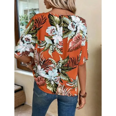 Blusa con estampado tropical de manga murciélago