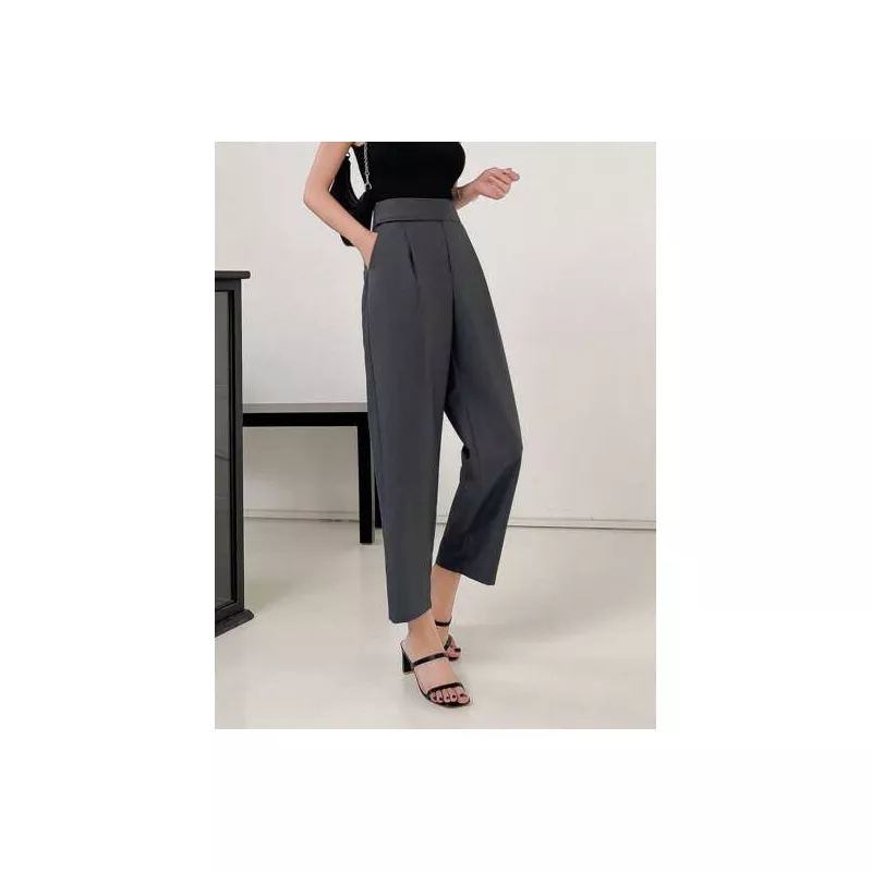 Pantalones de traje unicolor con bolsillo oblicuo crop